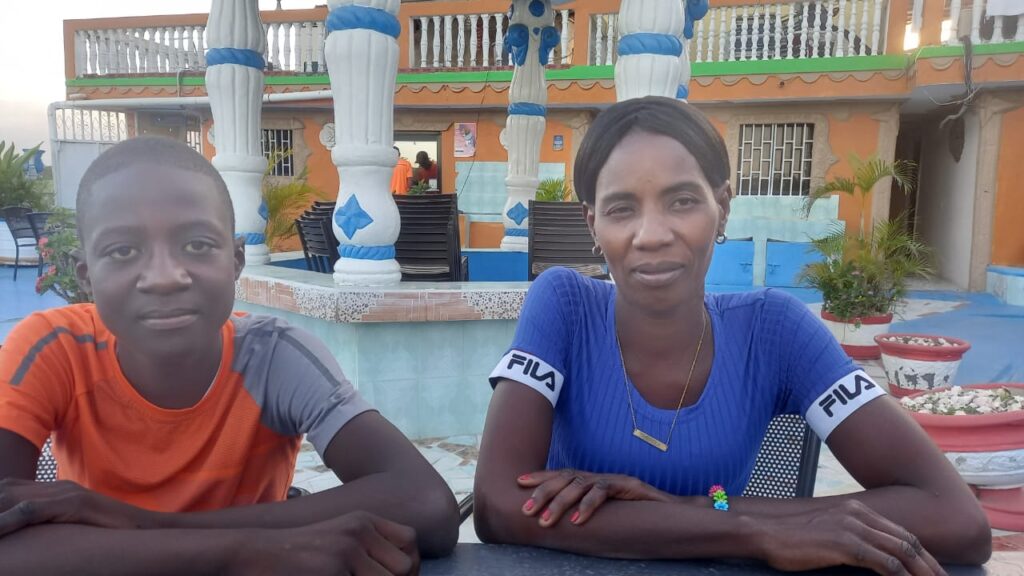 Kervenson and his mother in 2024.